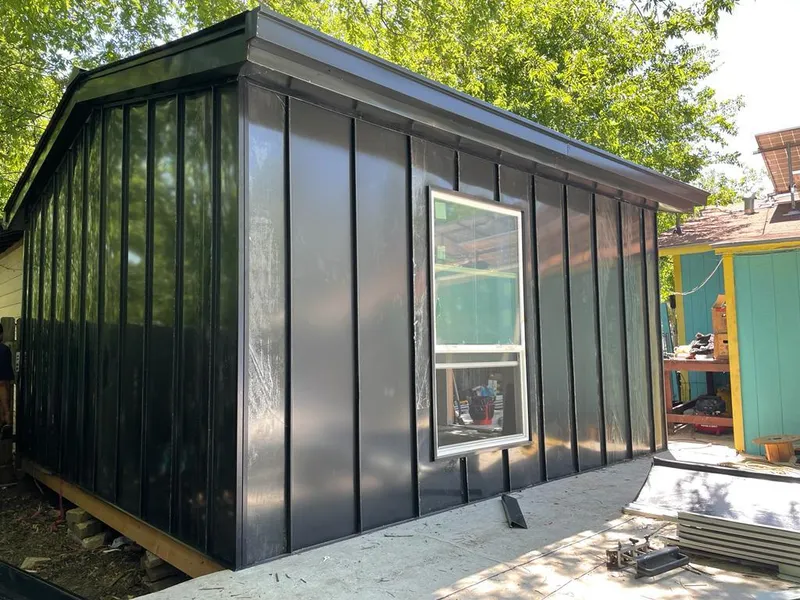 Black standing seam metal wall panels for Roof Inspection in Cottonwood Heights