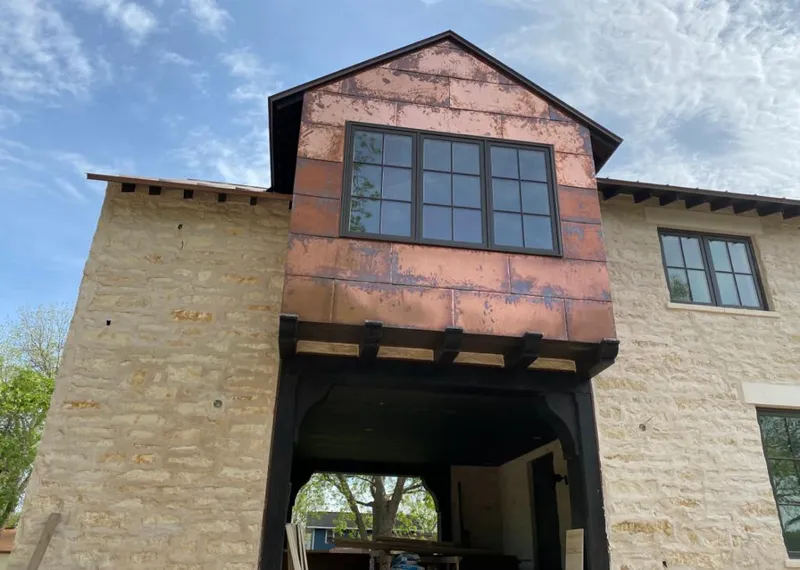 Copper metal panel facade on a stone building for Skylight Installation in Cottonwood Heights